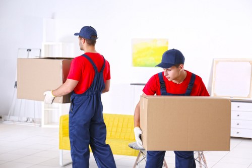 Loading boxes into a van during a removals service