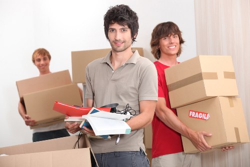 Professional movers loading household furniture for a Northolt relocation