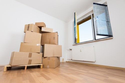 Staff unloading office items into a new workplace in Northolt