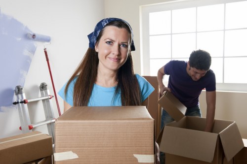 Fragile items being wrapped carefully for a move in Northolt