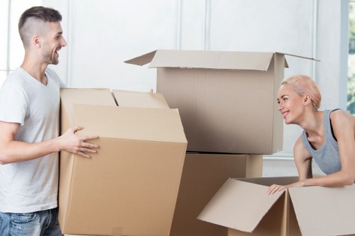 Furniture and boxes being loaded into a moving truck in Northolt
