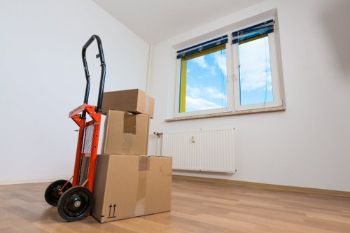 Furniture and boxes prepared for a man and van collection in Northolt