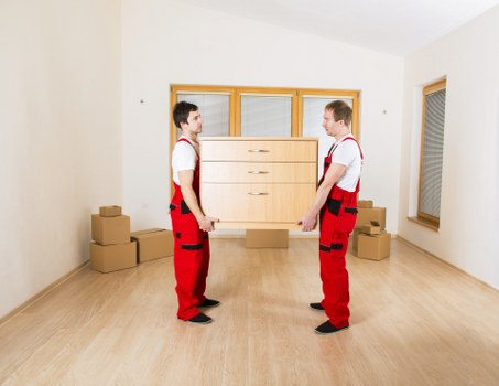 A removals team organising furniture and boxes during a local Northolt relocation