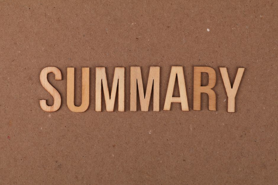 Close-up of the word 'SUMMARY' spelled out in light-colored wooden letters on a brown textured background, with no other objects or markings visible. The setting appears neutral and simple, suitable for use in a document or presentation context. This image's focus is on the clear display of the word, which may relate to summarising or overview tasks, such as planning or review in house removals or relocation services. The clean and straightforward design aligns with professional moving and packing activities, highlighting organisation and documentation aspects of home relocation or furniture transport processes.